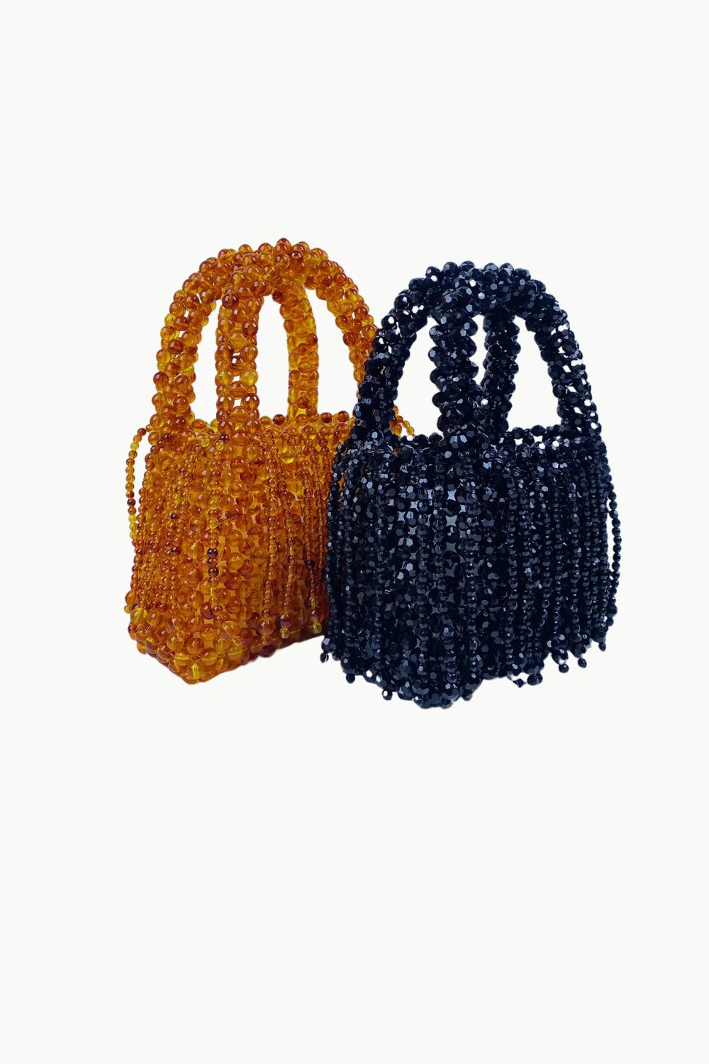 Brown beaded bag featuring two beaded handbags, one amber and one black