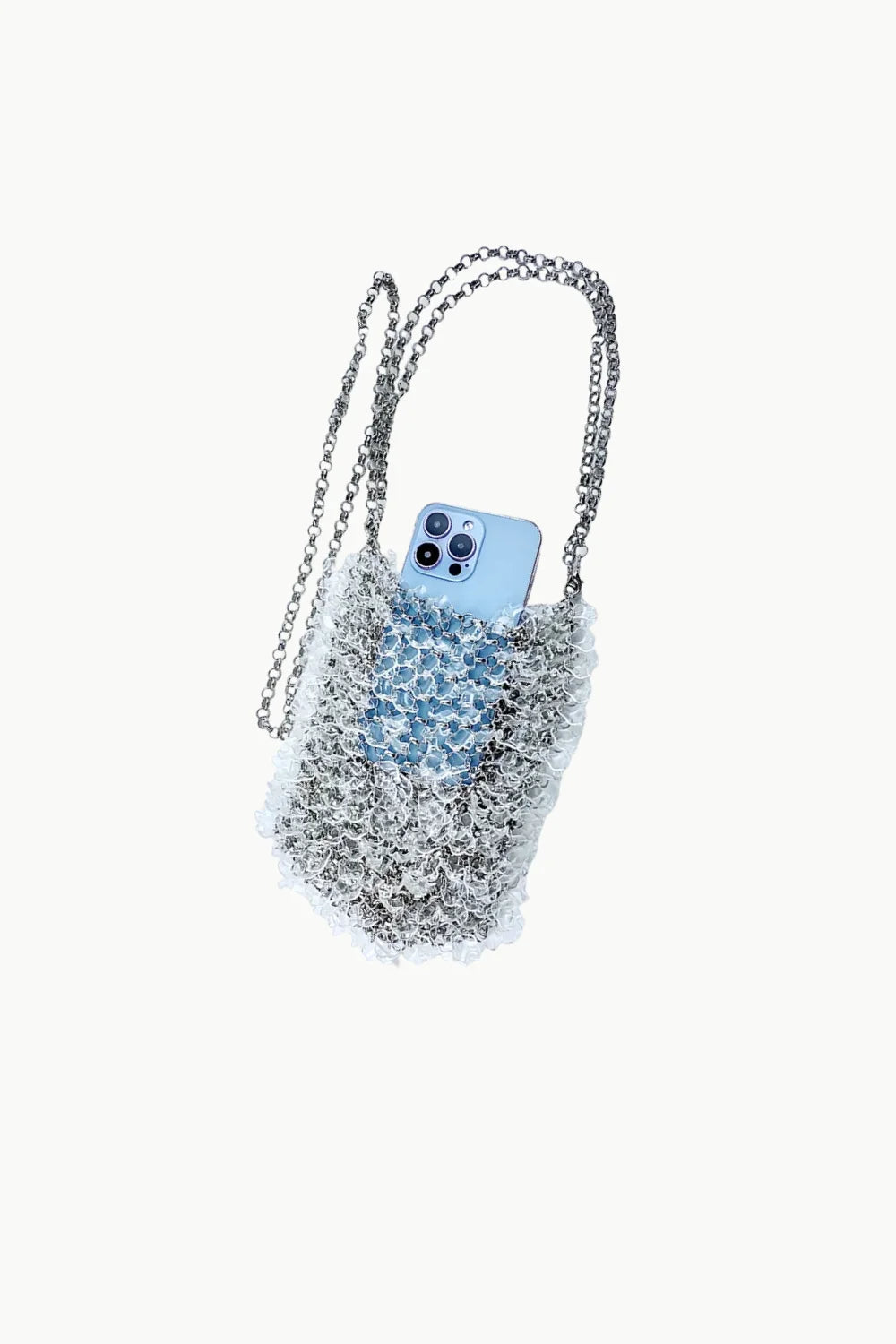 Silver chain-strap phone bag with light blue iPhone, a stylish beaded crossbody bag