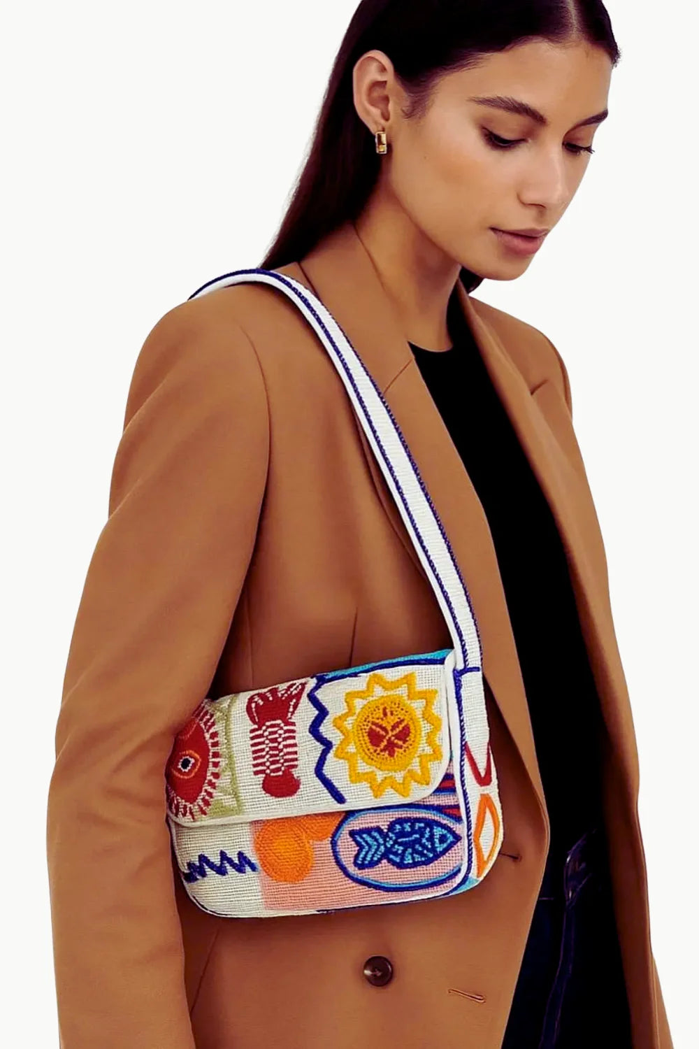 White beaded shoulder bag with colorful embroidered designs, perfect as a colorful beaded bag