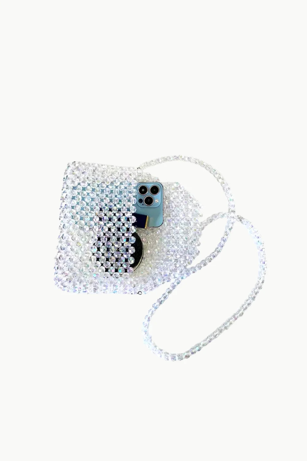 Beaded crossbody purse with light blue smartphone and black circular object inside