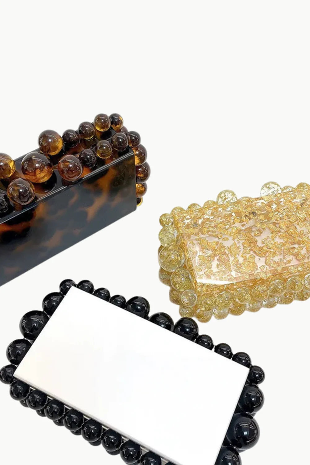 Three rectangular beaded clutch bags with spherical embellishments, perfect for custom beaded clutch collection