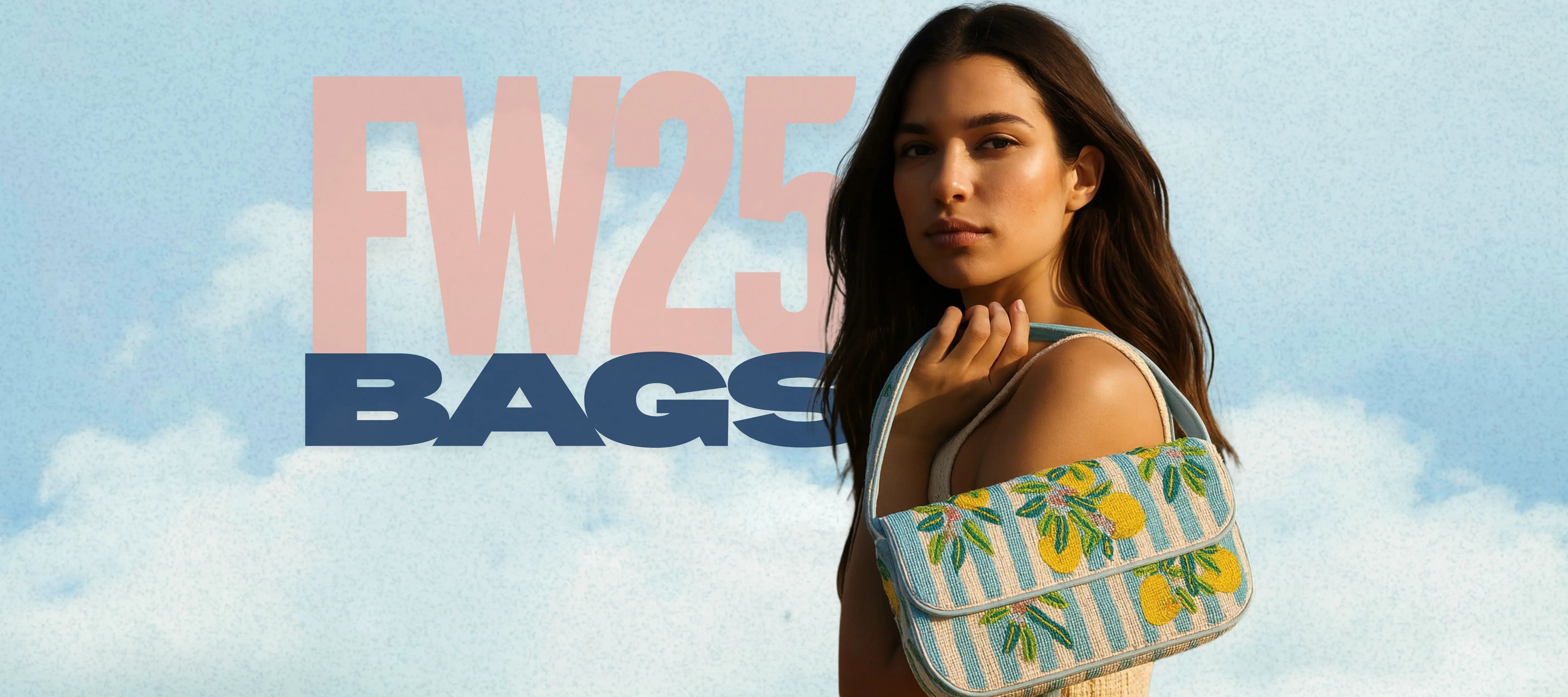 Model carrying a lemon-pattern beaded shoulder bag on shoulder against a sky backdrop FW25 bags campaign hero image