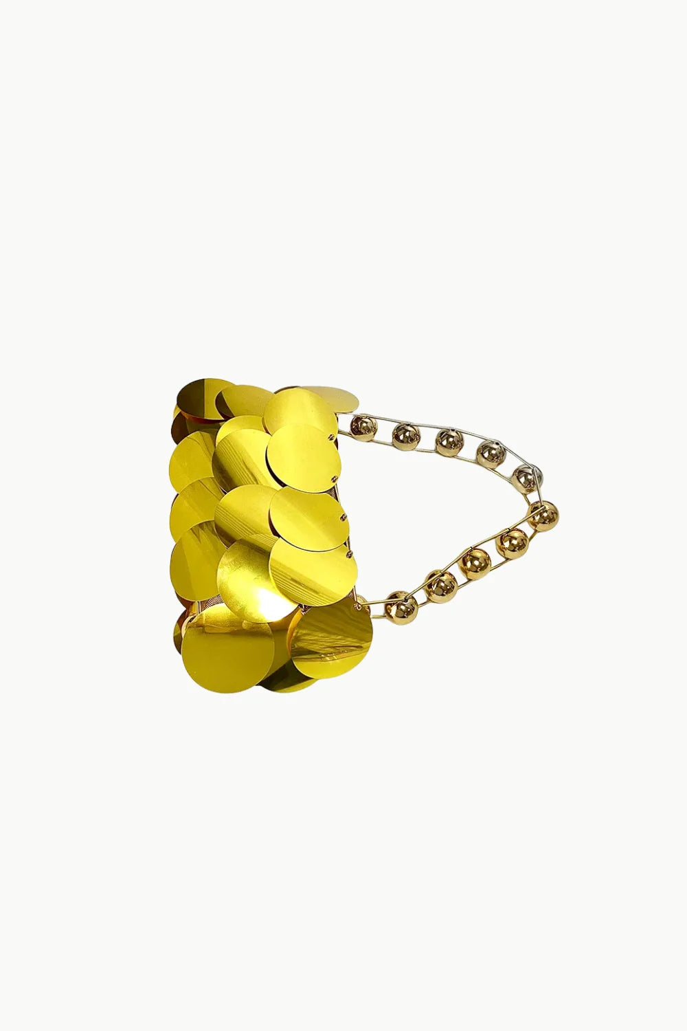 Gold beaded bracelet with beaded strap displayed on Gold Beaded Clutch for elegant style