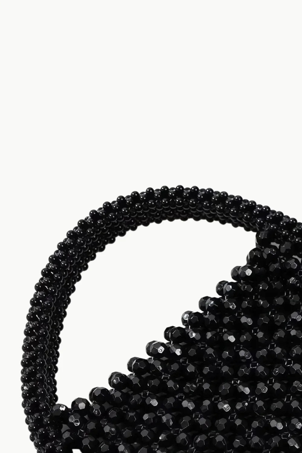 Gold beaded handbag with rounded handle, stylish beaded handbag accessory