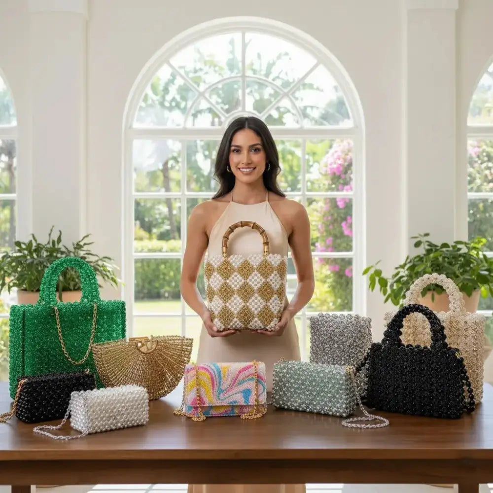 Woman holding a handbag with various other handbags displayed on a table in a bright room. Image
