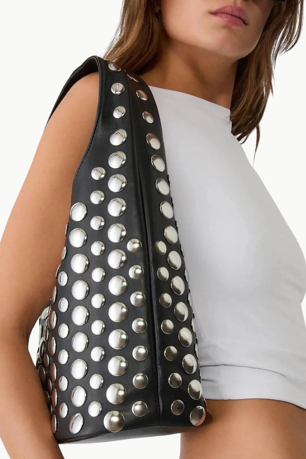Black leather beaded bucket bag with silver stud embellishments for stylish shoulder wear