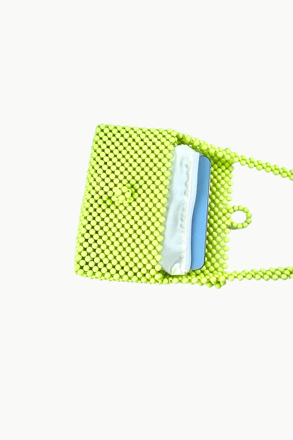 Neon green beaded handbag with white and blue item inside, stylish light green beaded accessory
