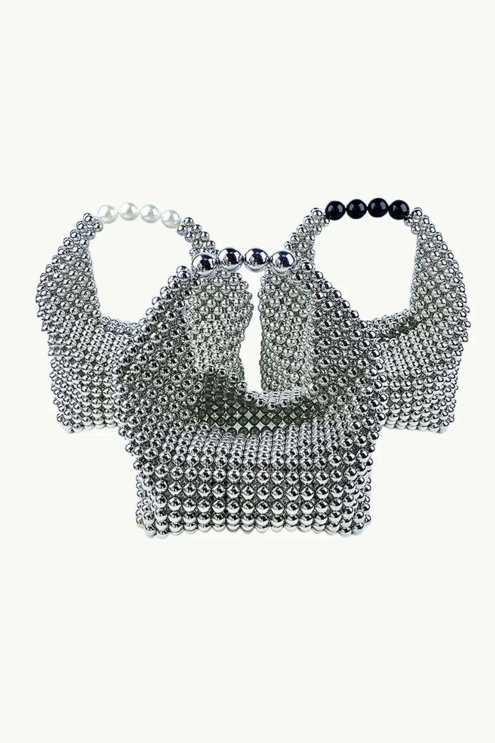 Metallic beaded bag with three silver beaded handbags featuring colorful handles