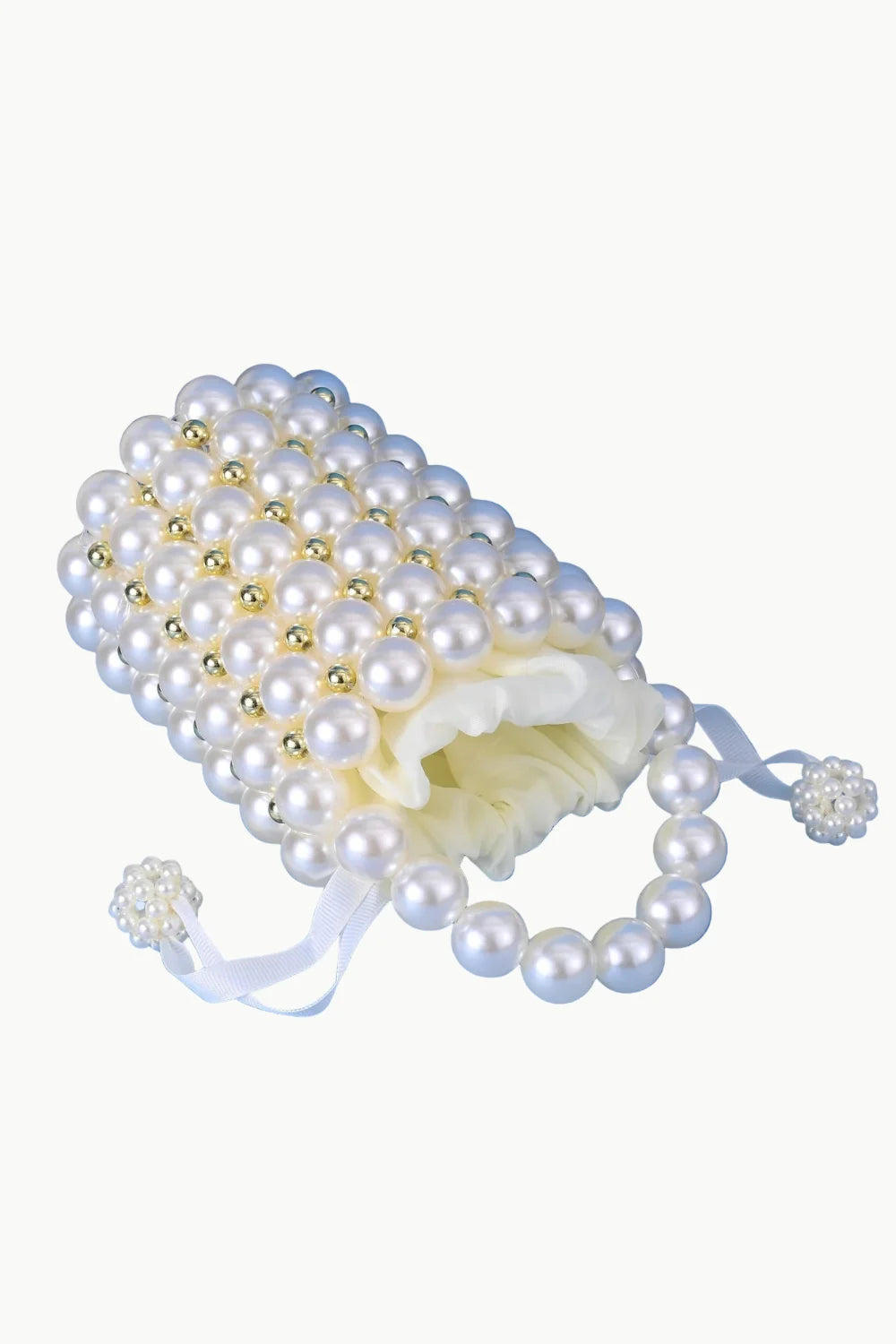 Pearl bucket bag with white pearls, gold beads, pearl handle, and pearl-encrusted toggles