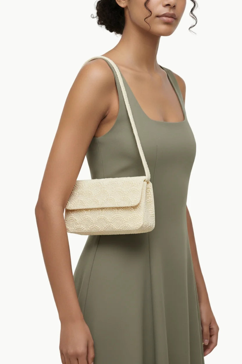 Cream-colored Pearl Beaded Handbag with flap closure, stylish beaded handbag for women