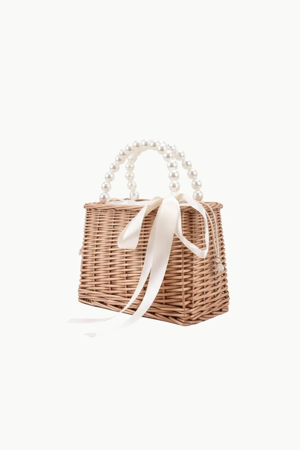 Woven wicker pearl straw bag with pearl handles and cream ribbon for stylish summer look