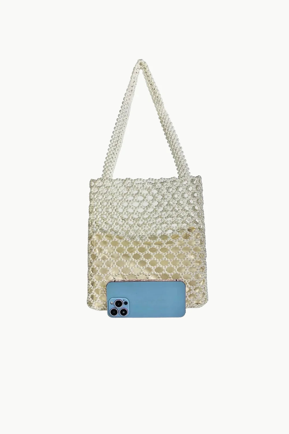 Two-tone pearl tote bag with light blue smartphone in front, stylish tote bag accessory