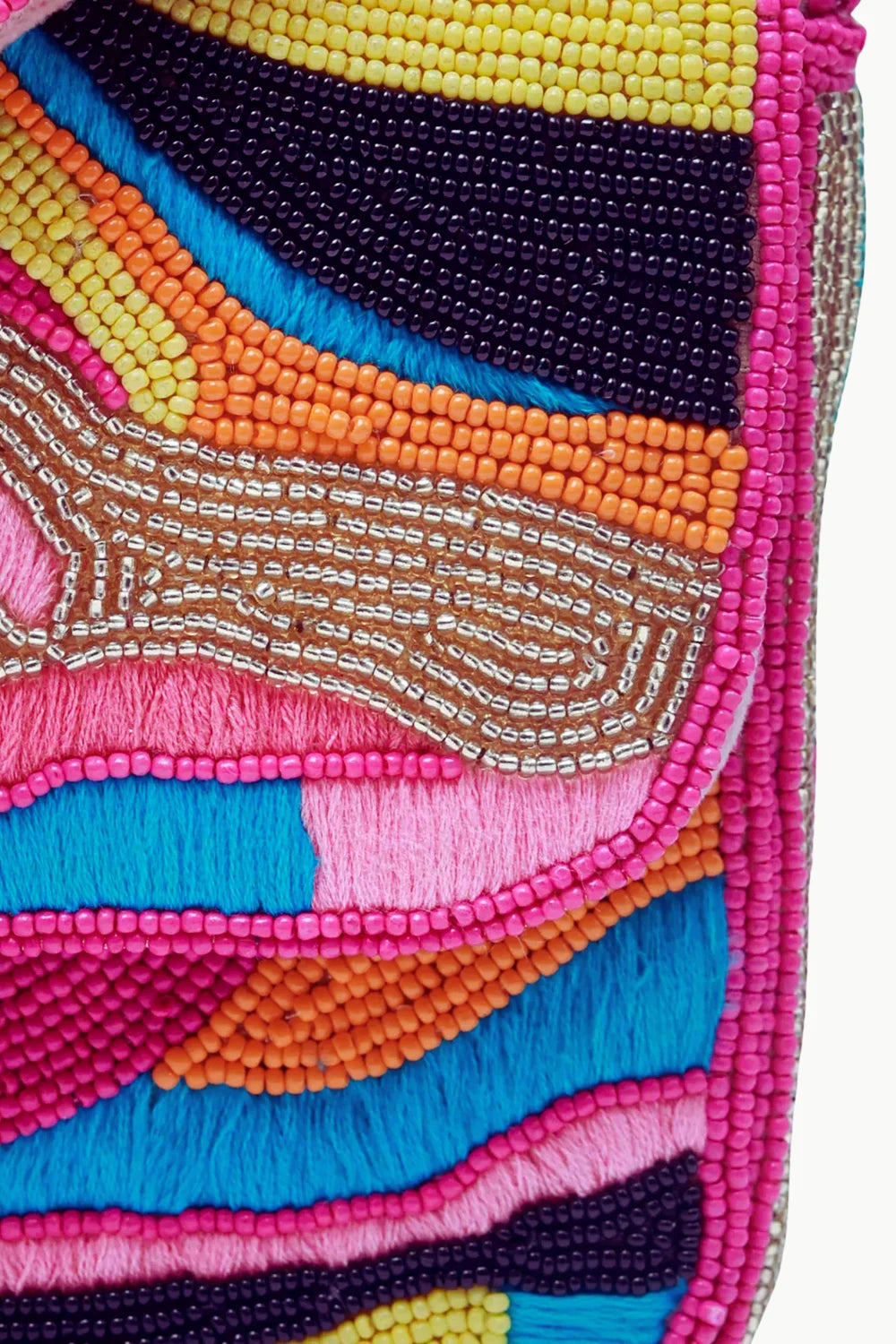 Pink beaded handbag featuring vibrant embroidered textile with abstract patterns