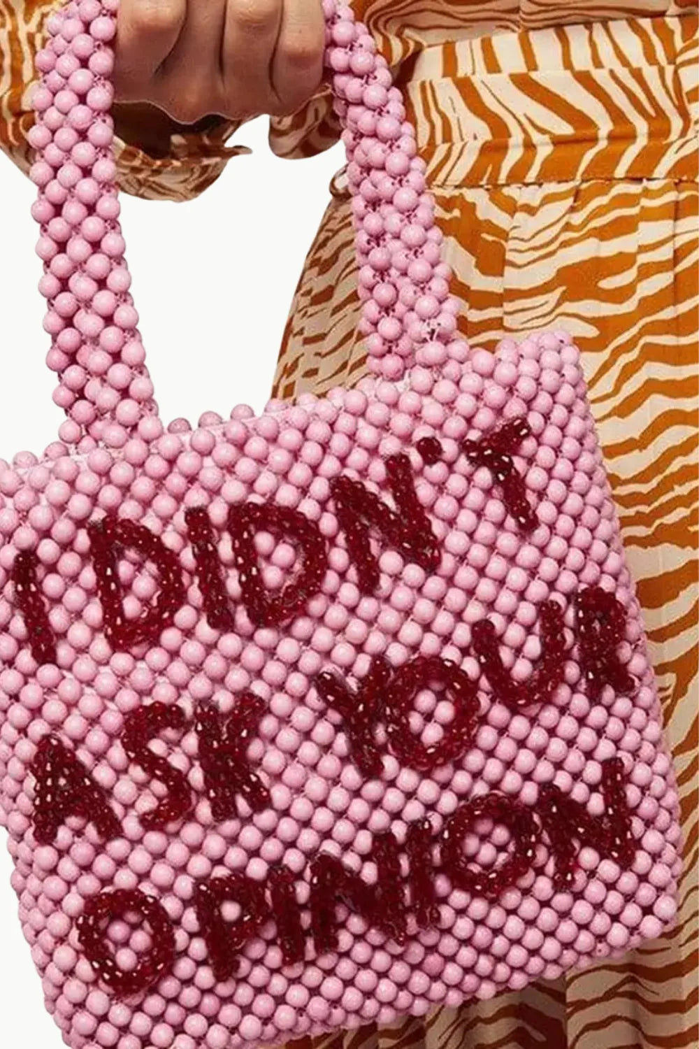 Pink beaded tote bag with darker beads spelling I DIDN T ASK YOUR OPINION for stylish accessorizing