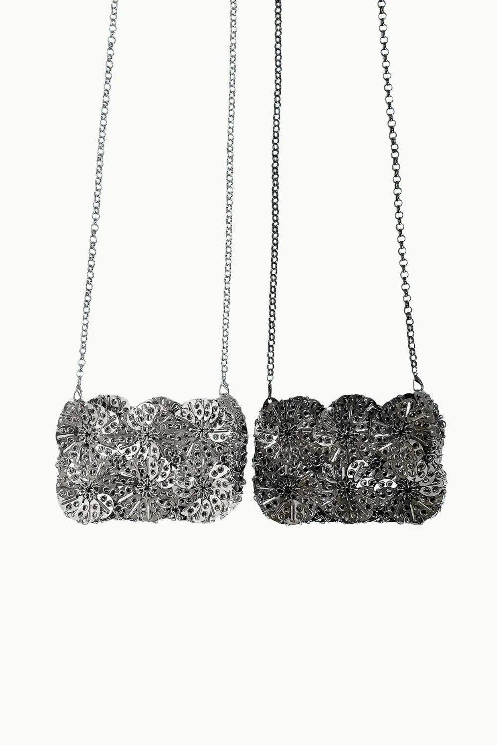 Silver beaded clutch with two chain necklaces featuring rectangular textured pendants