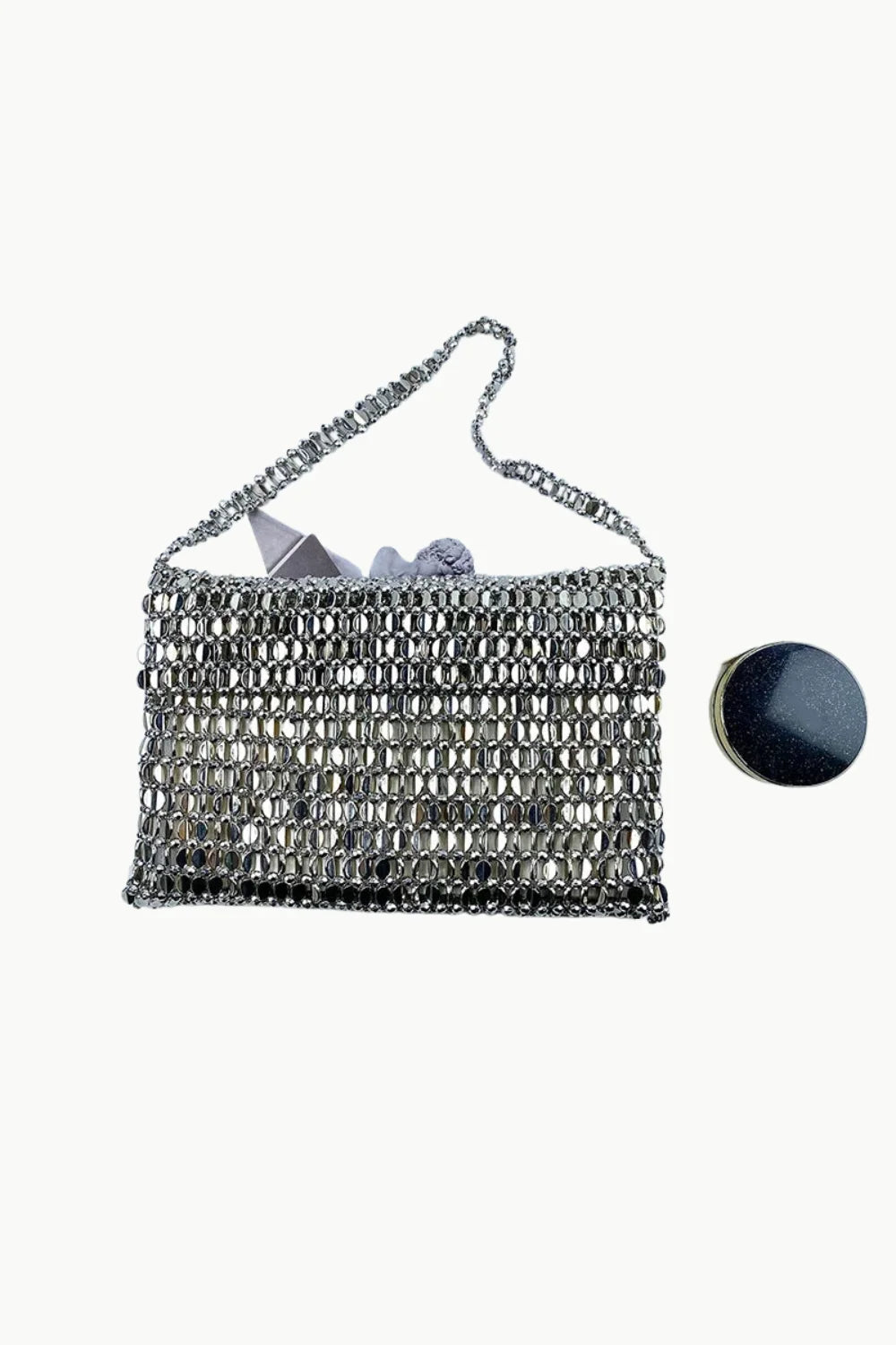 Silver beaded evening bag with metallic closure, perfect for stylish beaded evening occasions