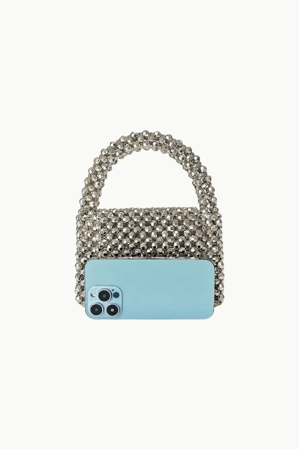 Silver Beaded Handbag with Light Blue Smartphone Placed Horizontally in Front