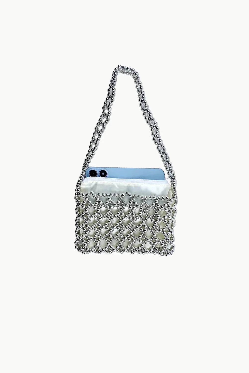 Silver beaded shoulder bag with light blue smartphone inside for stylish accessory look