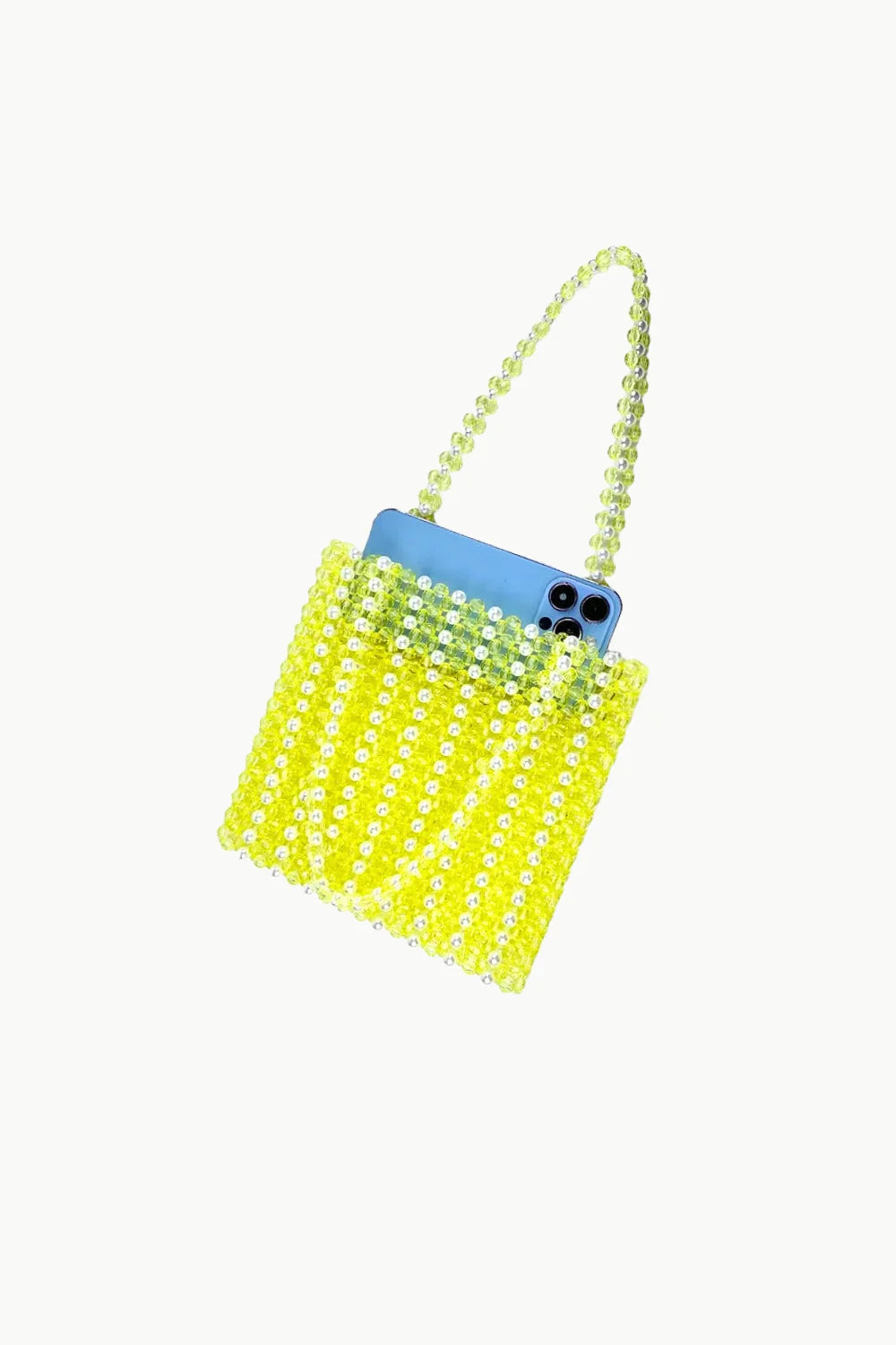Neon yellow Sol Mer beaded bag with light blue smartphone inside for stylish carry