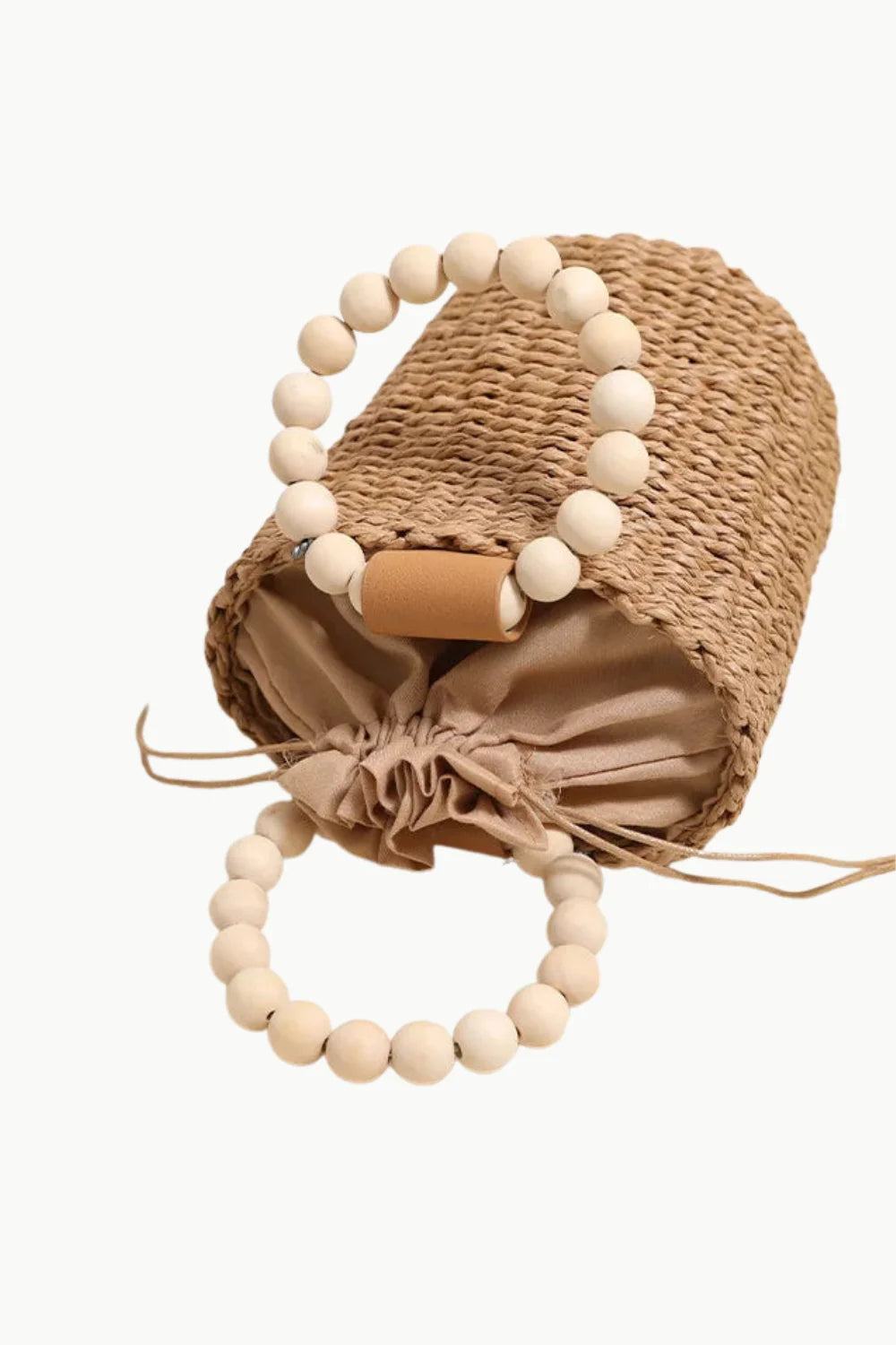 Woven straw bead bucket bag with wooden bead handles and drawstring closure