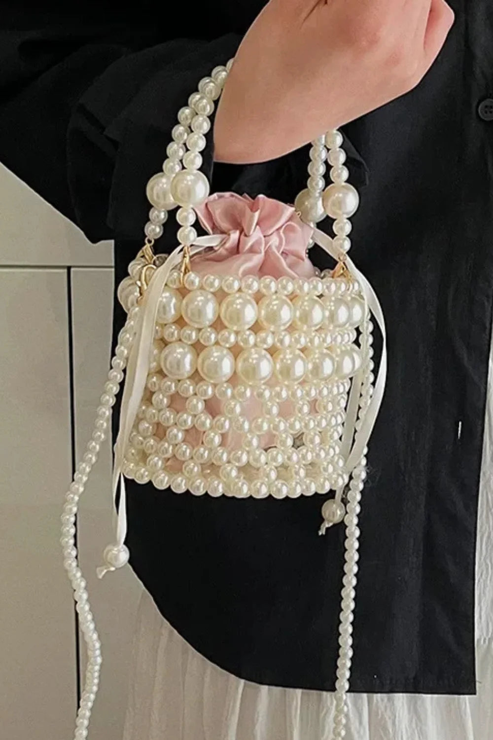 Trendy Bead Bucket Bag with white pearls, pink drawstring pouch, double pearl handle