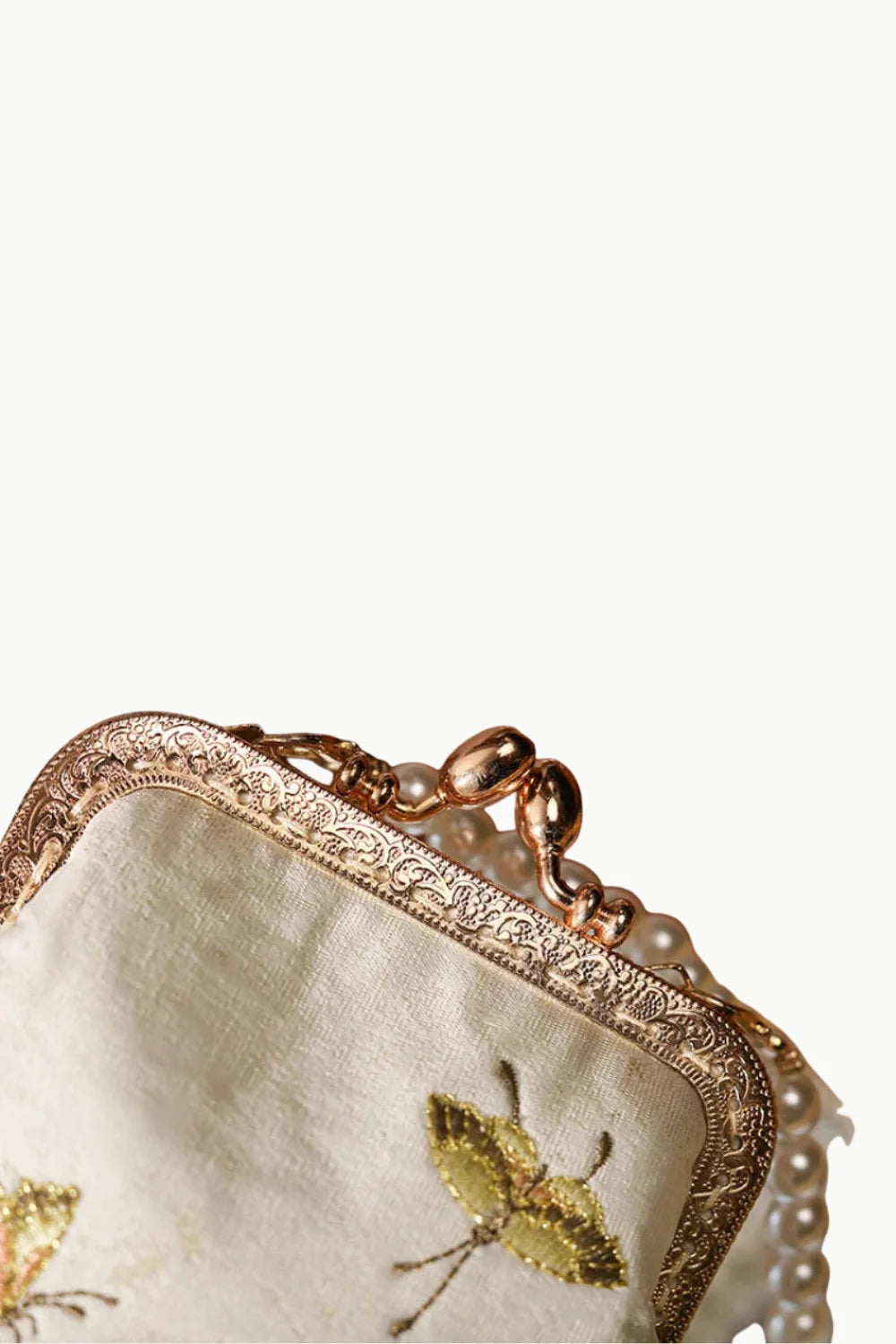 Embroidered cream vintage beaded coin purse with ornate brass frame and pearl strap
