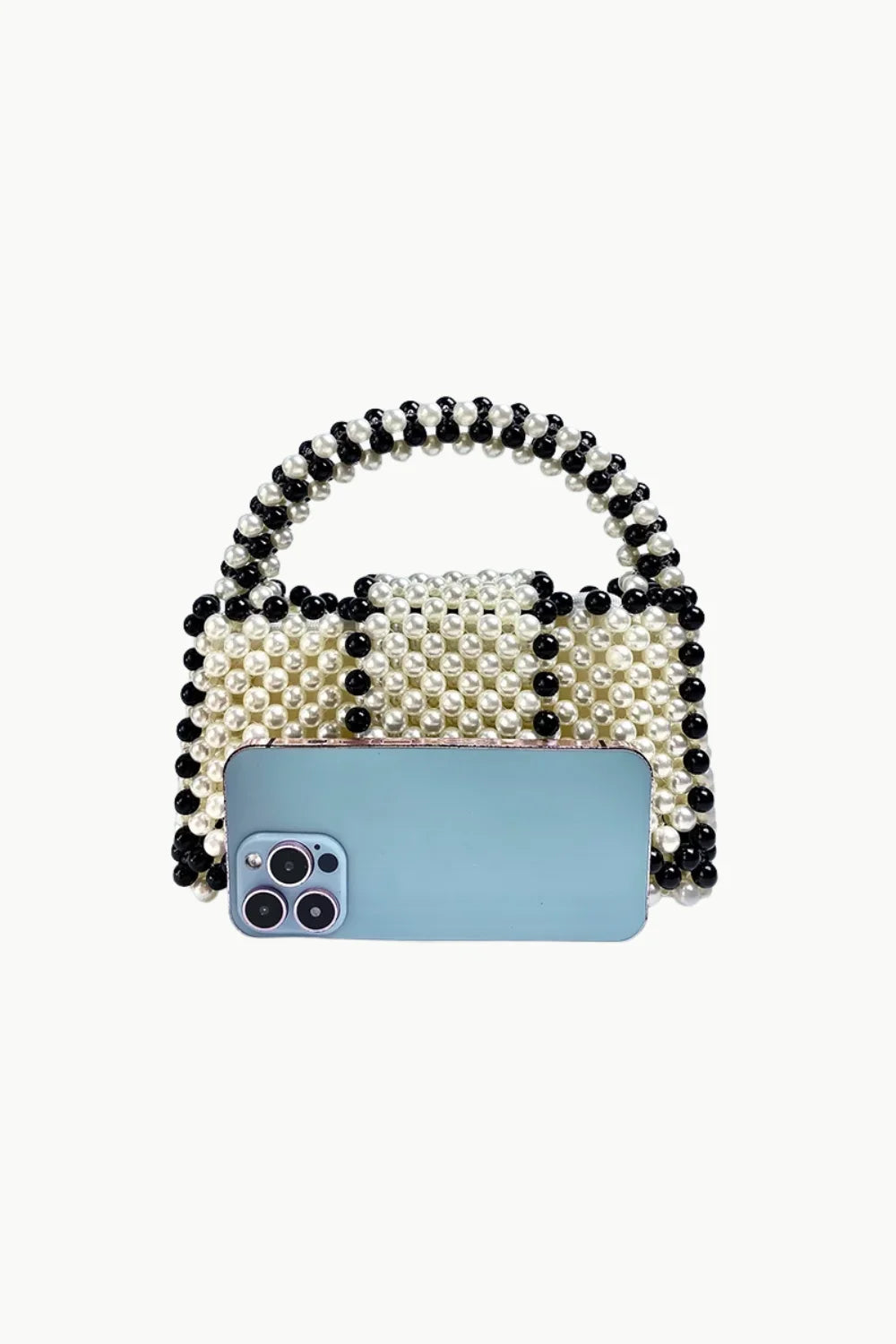 Vintage black beaded purse with a light blue smartphone in front, stylish beaded handbag