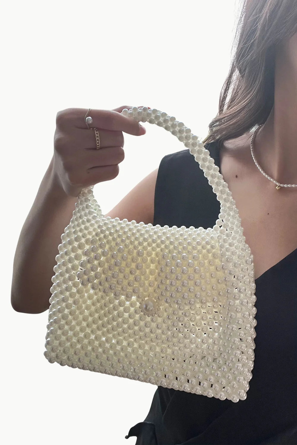 Vintage pearl bag with white pearl beads and matching pearl handle for elegant style