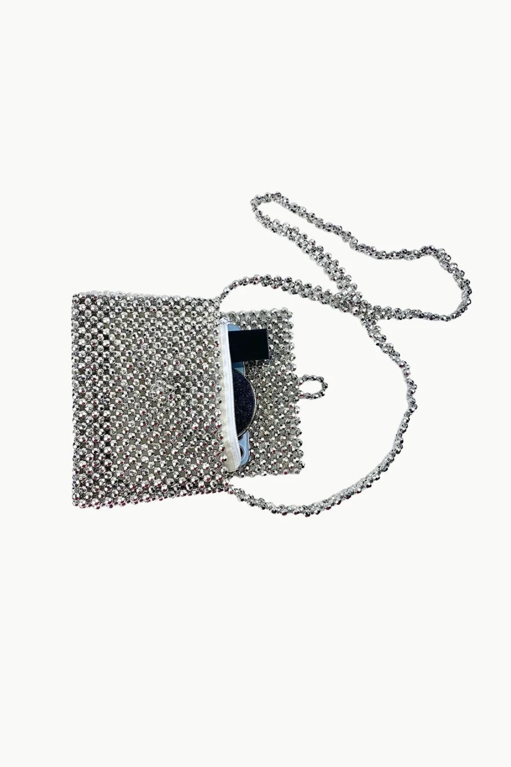 Vintage silver beaded bag with rhinestones, open to show black interior and chain strap