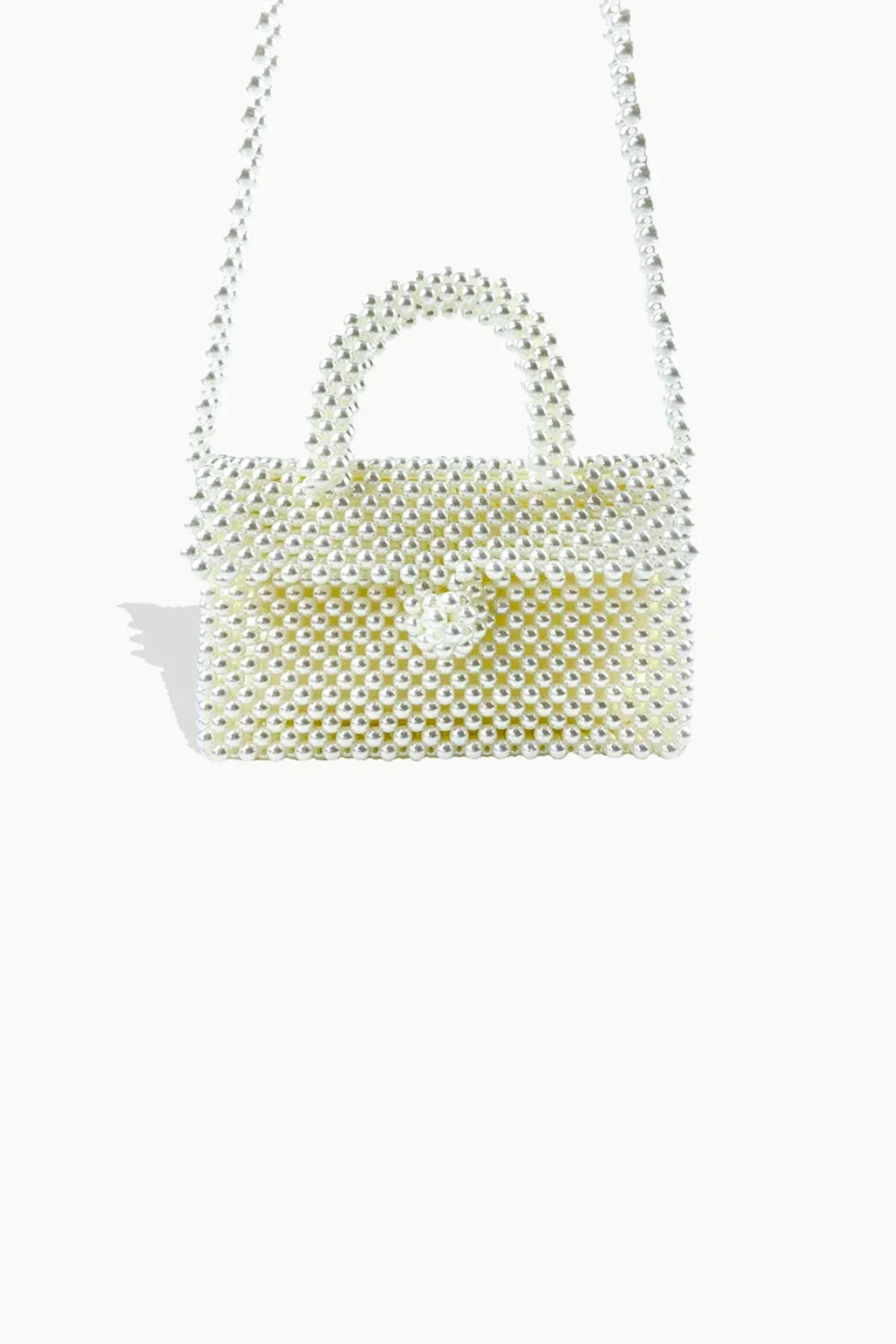 White beaded handbag with top-handle, beaded faux pearl design, magnetic closure