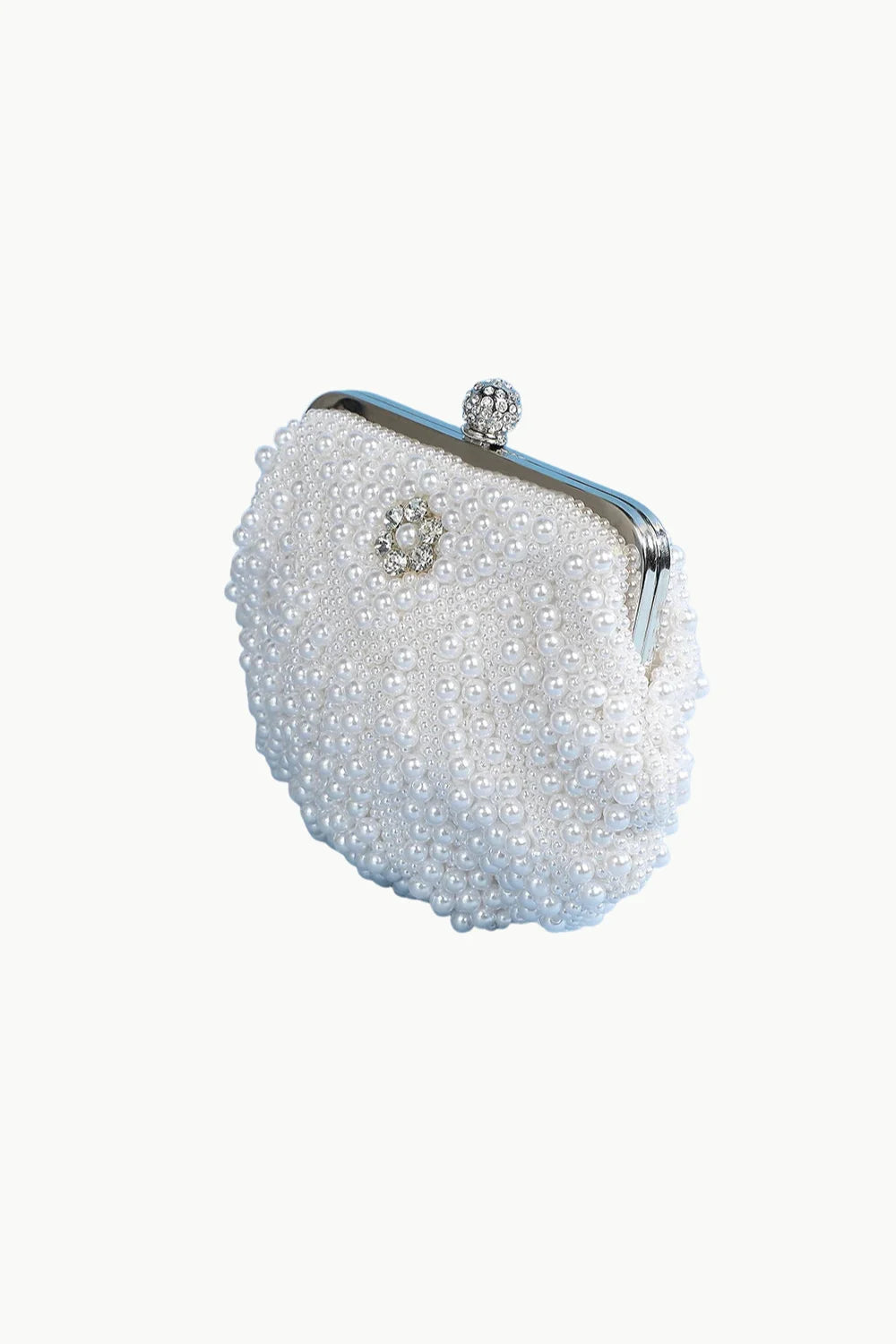 White pearl clutch bag with silver frame and rhinestone clasp for elegant occasions