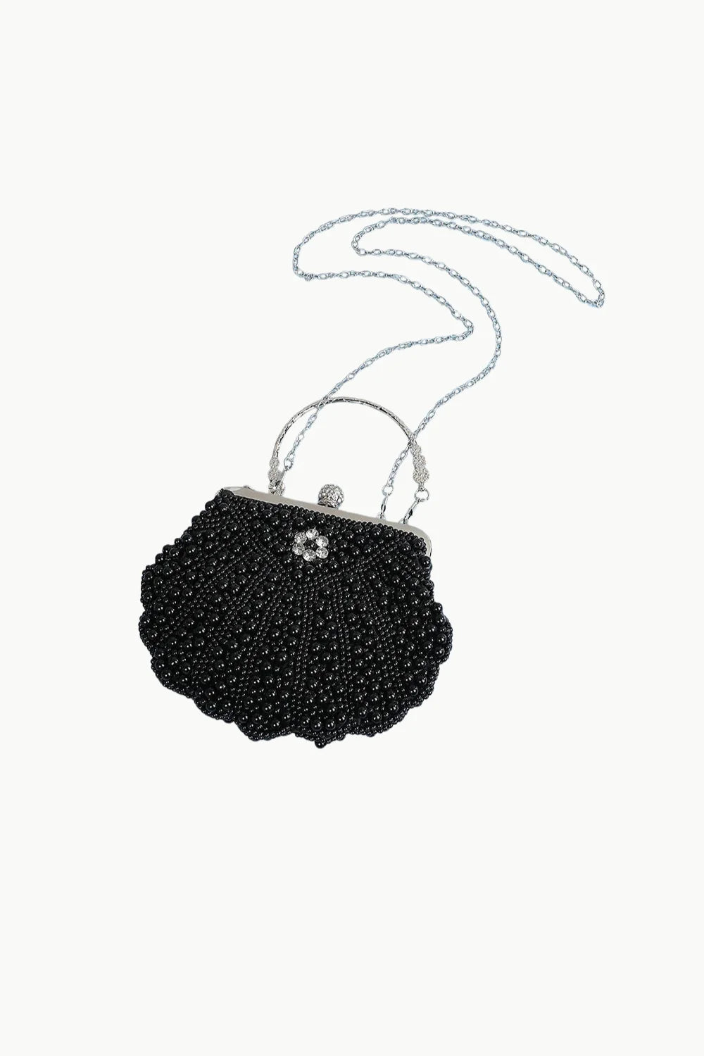 Black beaded seashell-shaped clutch with silver chain strap and rhinestone flower clasp