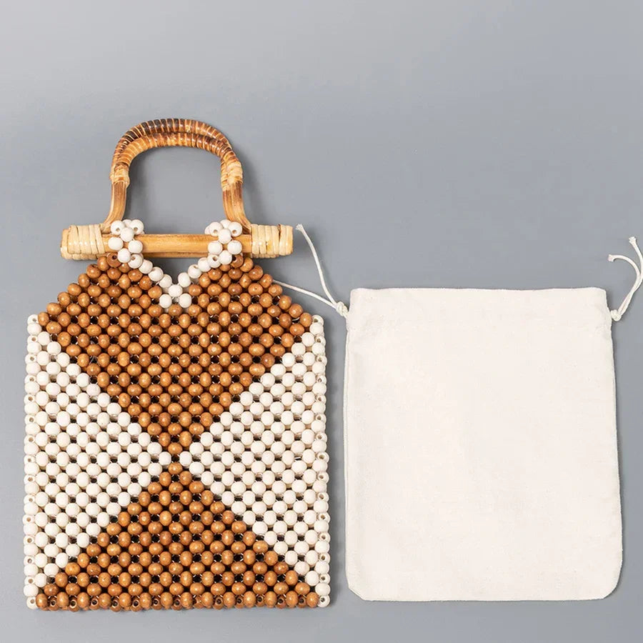 Handcrafted wood bead purse with bamboo handle and white fabric drawstring pouch