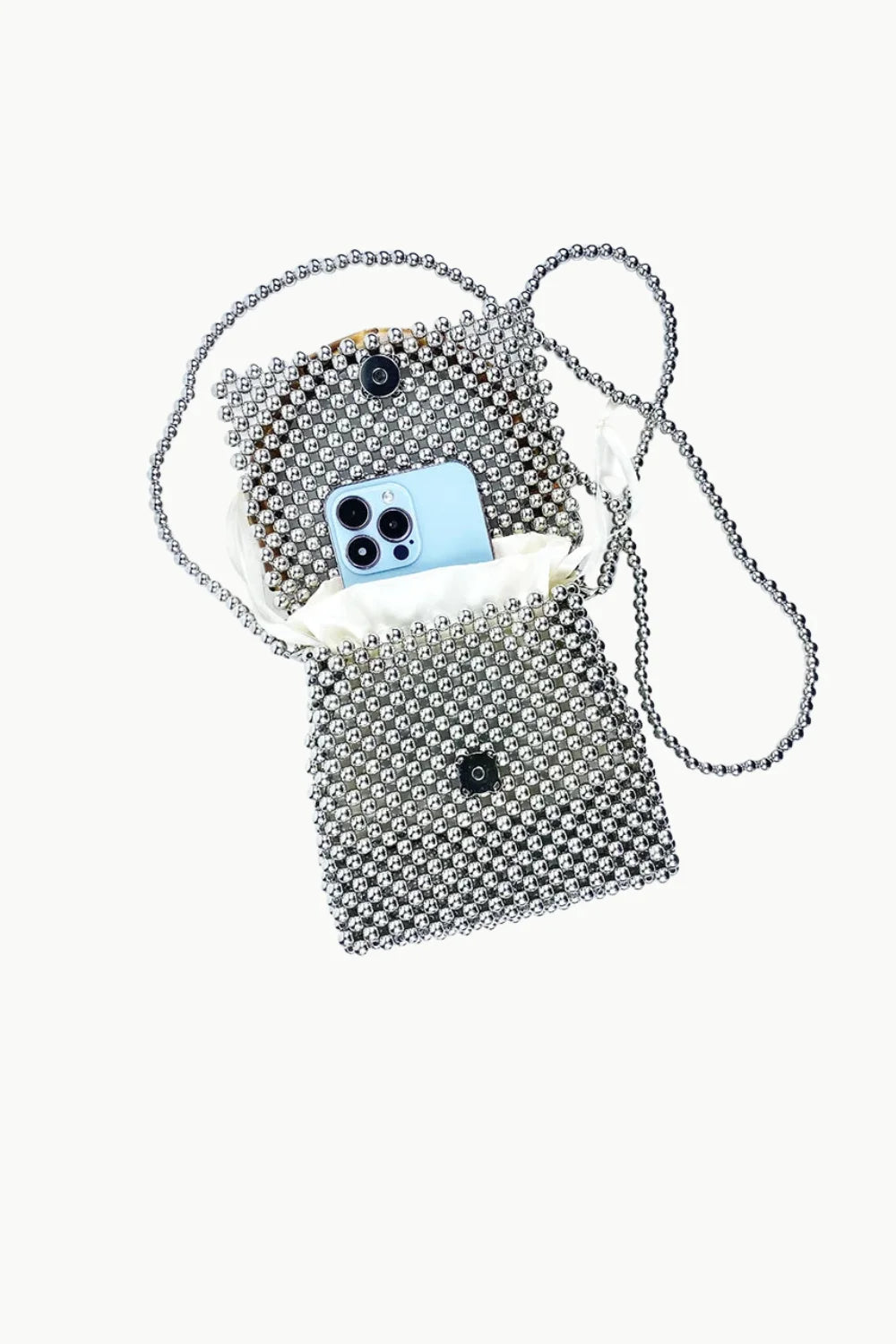 Silver beaded crossbody bag with light blue smartphone inside, stylish wooden beaded bag