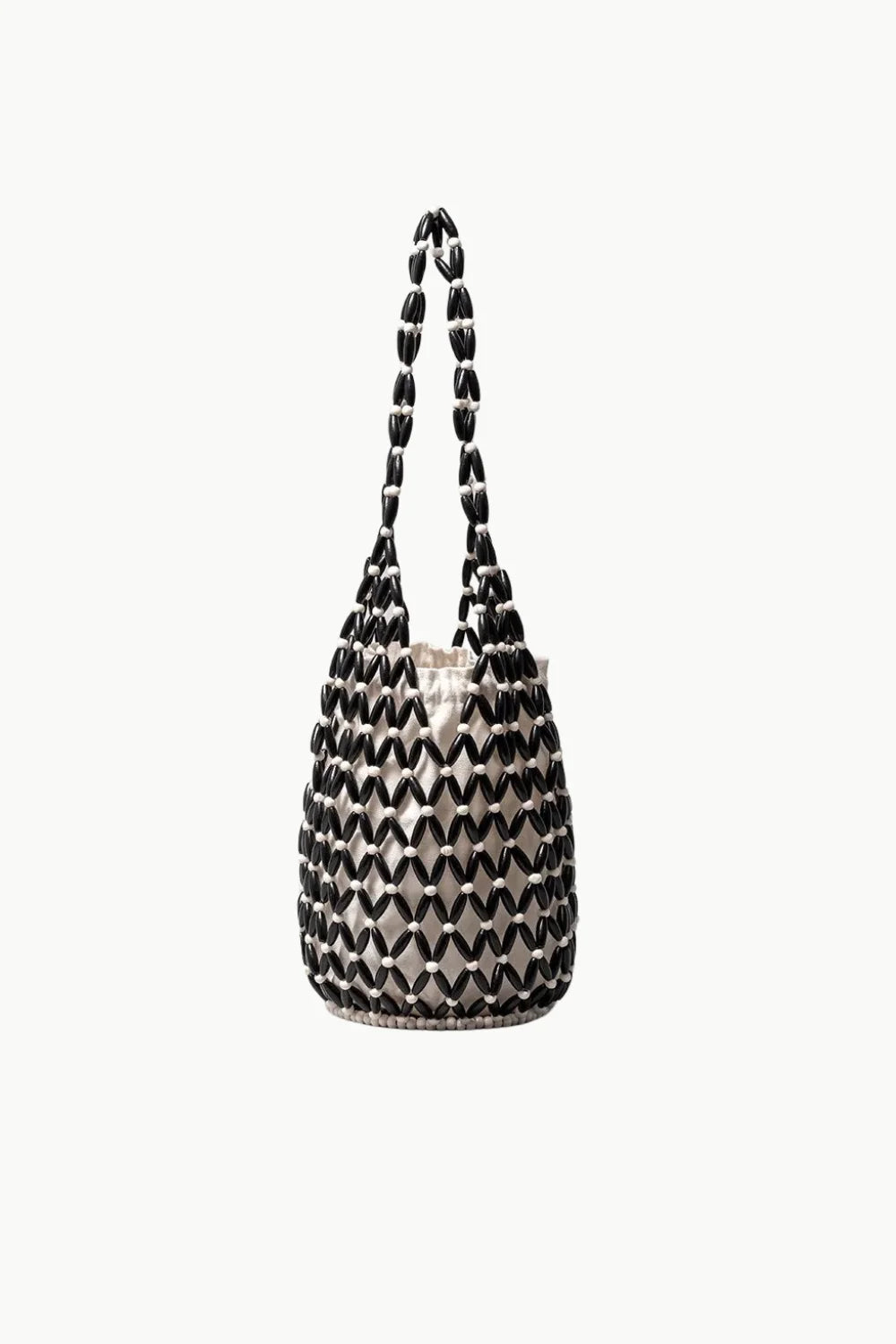Black and white woven beaded tote bag with drawstring closure, stylish beaded tote bag